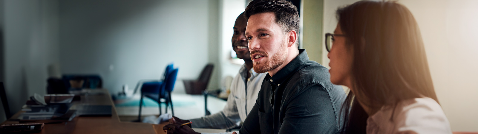 Colleagues talking and smiling