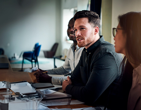 Colleagues talking and smiling