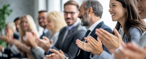 Joyful Professionals Celebrating with Applause